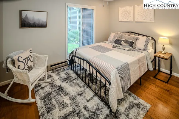 a bedroom with a bed and a table in it