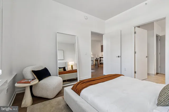 a bedroom with a bed and a couch