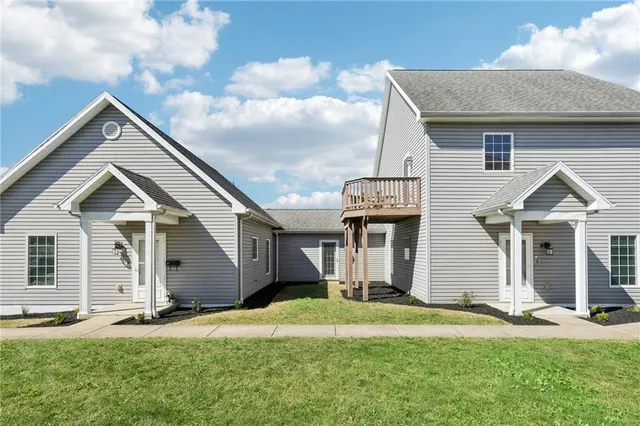 front view of a house with a yard