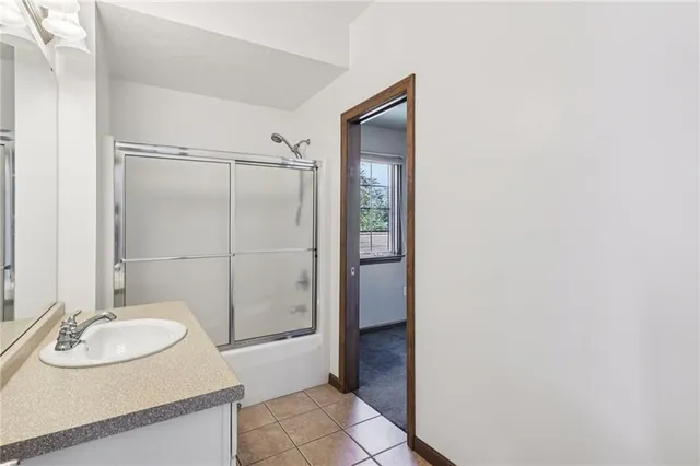 a bathroom with a sink and mirror