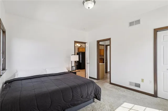 a view of a room with an empty space and a window