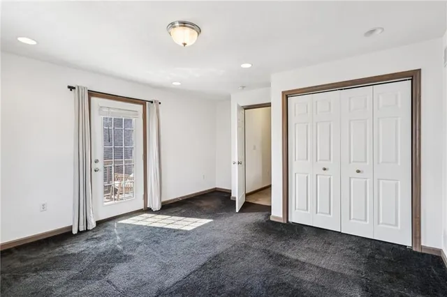 an empty room with a empty space and window