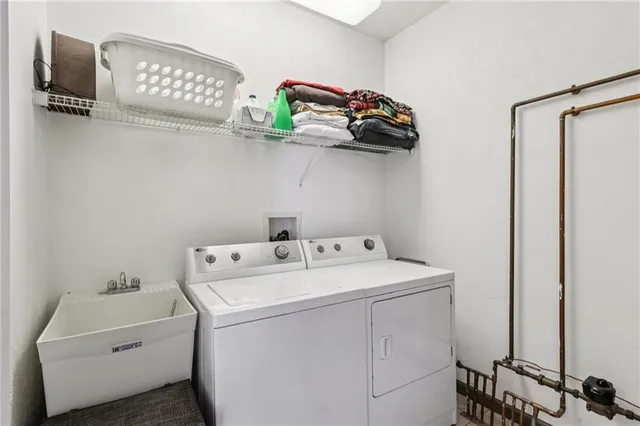 a view of a chair and table on the roof deck