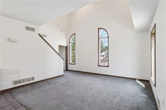 a kitchen with a refrigerator and cabinets