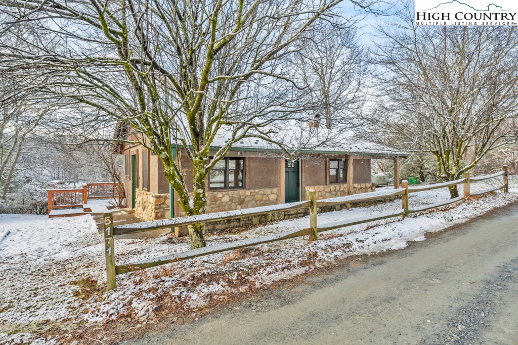 5171 Edgemont Road Collettsville, NC 28611 - Photo 2 of 21 a view of a house with a yard and a large tree