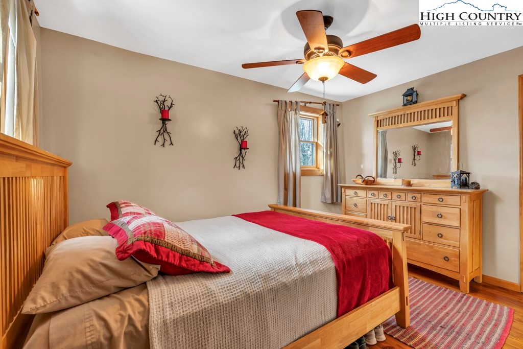 5171 Edgemont Road Collettsville, NC 28611 - Photo 9 of 21 a bedroom with a bed and a chandelier