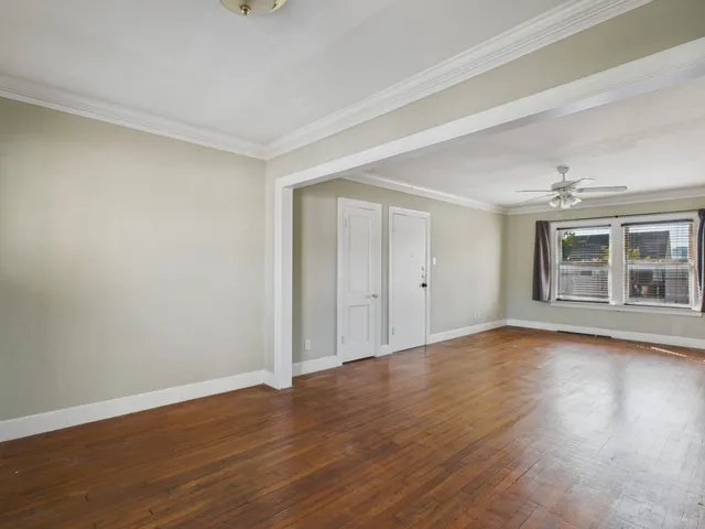 a view of a livingroom with wooden floor