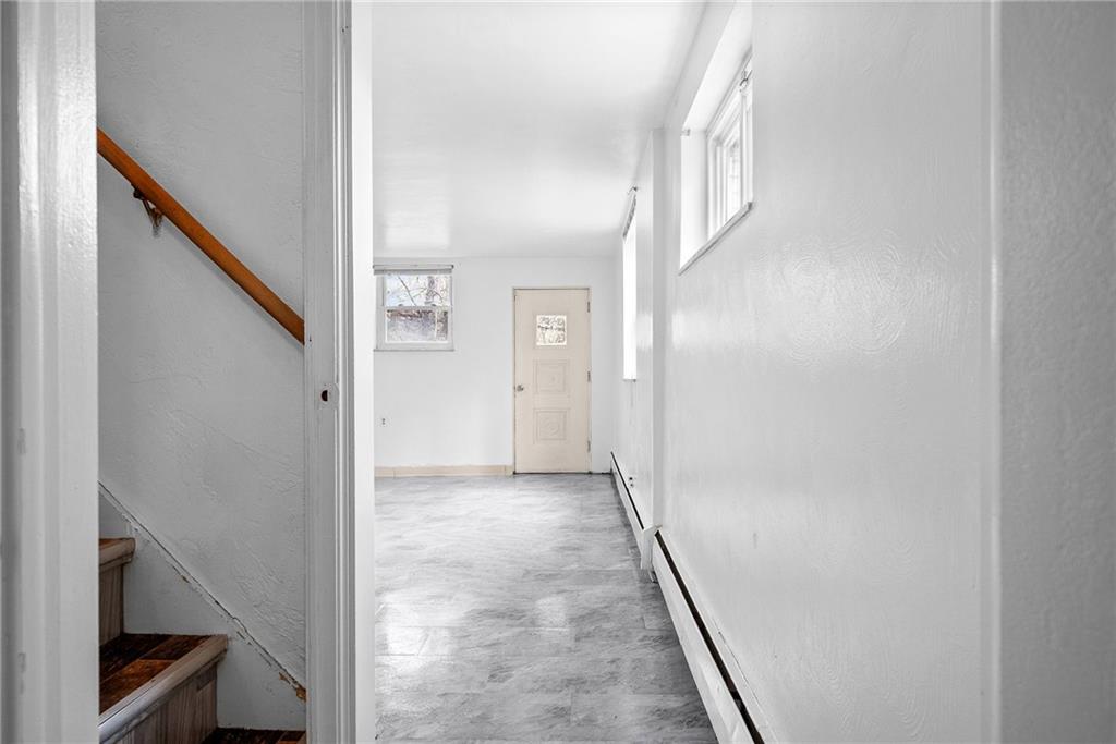 1353 Bower Hill Road Bridgeville, PA 15017 - Photo 19 of 45 Lower level hallway with brand new floors