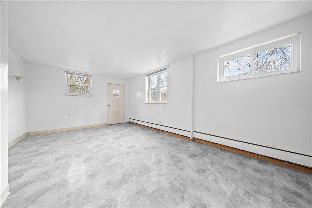 1353 Bower Hill Road Bridgeville, PA 15017 - Photo 23 of 45 Lower level living room with brand new floors