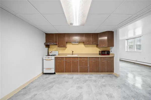 a view of an empty room with closet