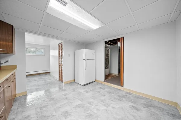 a kitchen with a refrigerator a stove a microwave and cabinets
