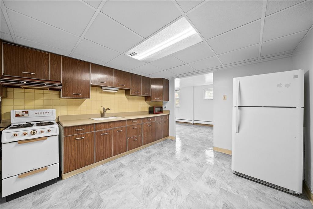 1353 Bower Hill Road Bridgeville, PA 15017 - Photo 26 of 45 Lower level kitchen with brand new floors