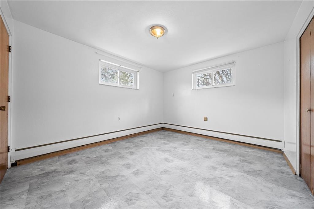 1353 Bower Hill Road Bridgeville, PA 15017 - Photo 27 of 45 Lower level primary bedroom with brand new floors