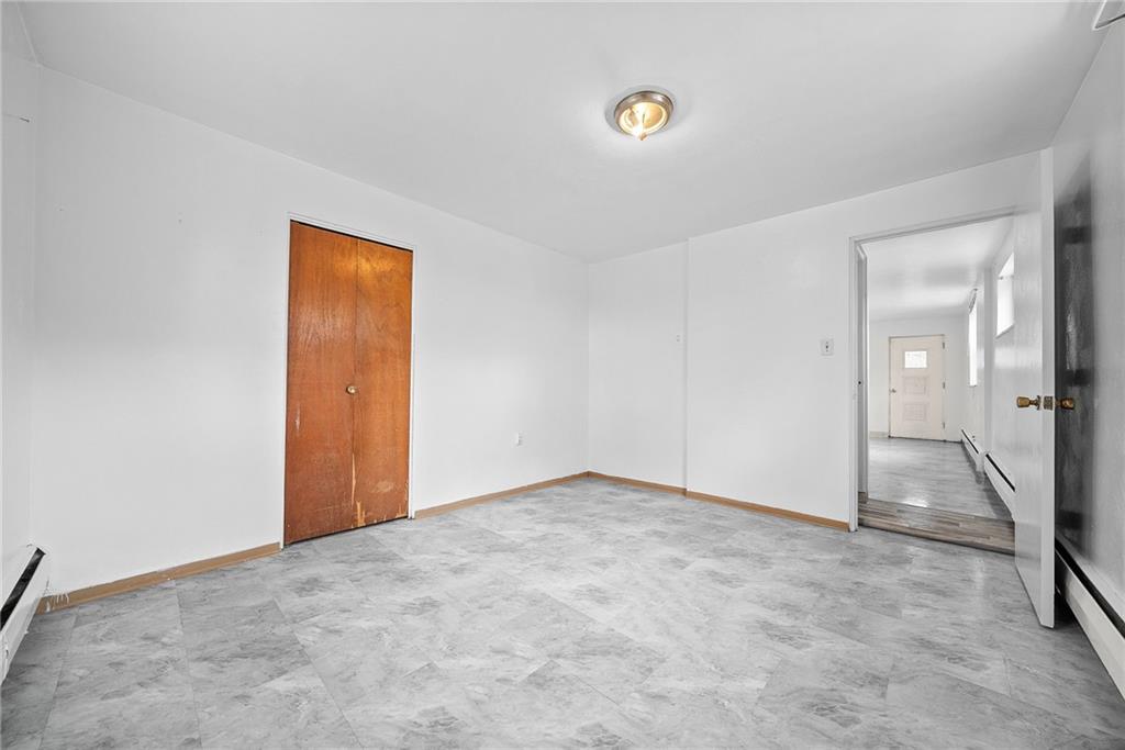 1353 Bower Hill Road Bridgeville, PA 15017 - Photo 28 of 45 Lower level primary bedroom with brand new floors