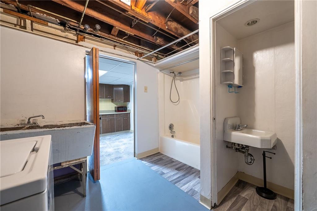 1353 Bower Hill Road Bridgeville, PA 15017 - Photo 30 of 45 Lower level laundry with freshly painted concrete flooring.