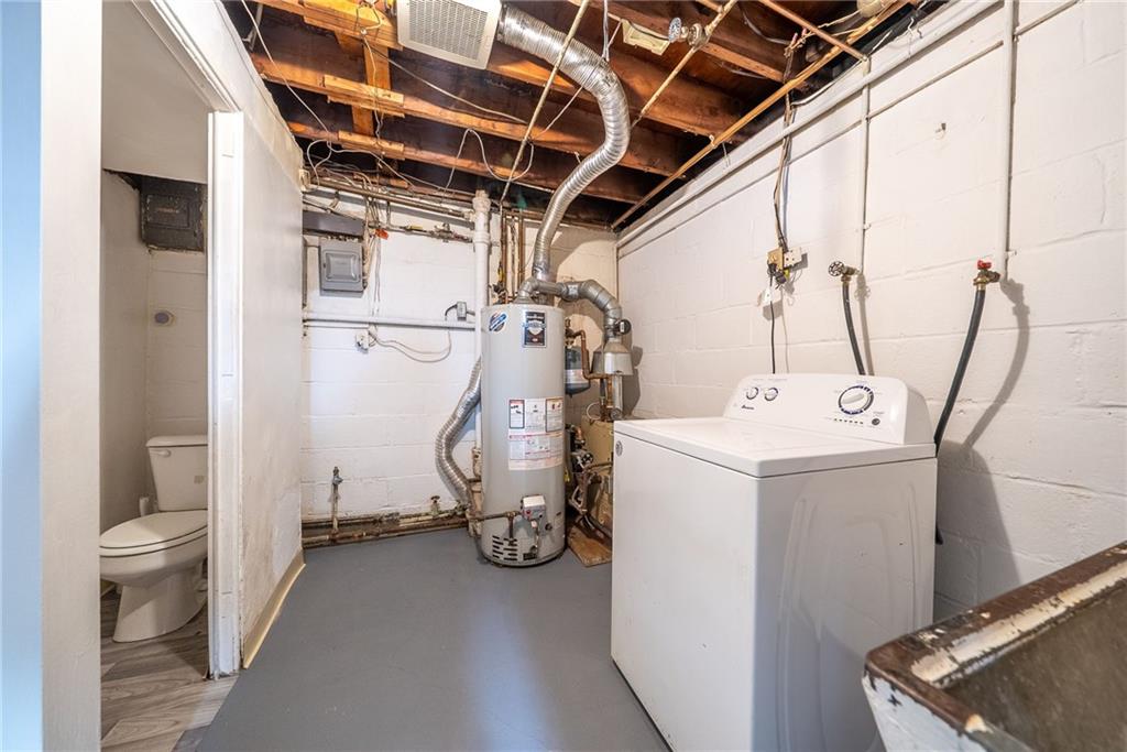 1353 Bower Hill Road Bridgeville, PA 15017 - Photo 31 of 45 Lower level laundry with freshly painted concrete flooring.