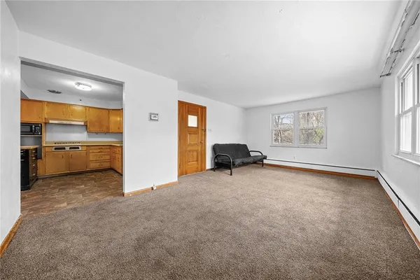 a view of a big room with windows and cabinet