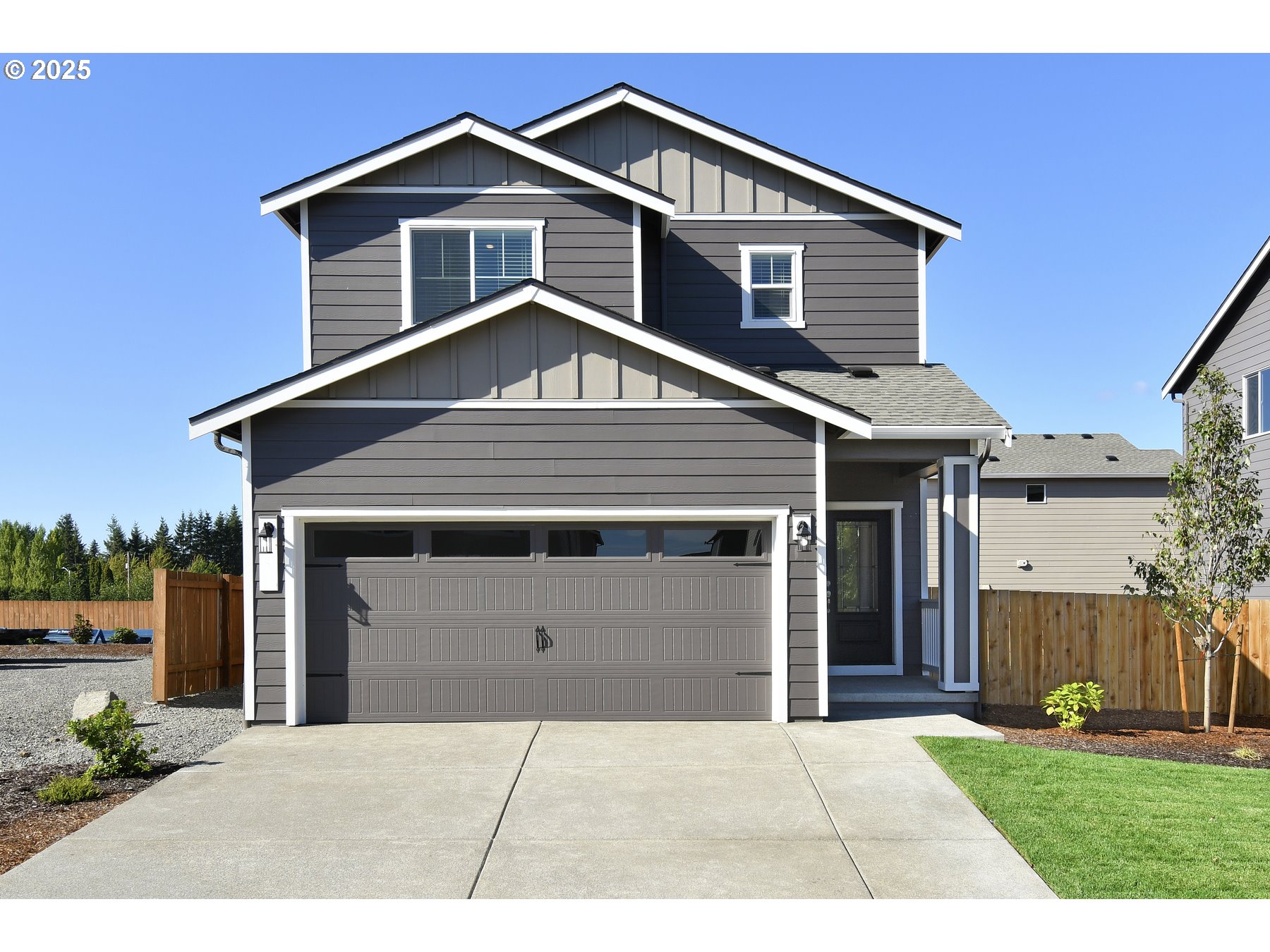 3990 Southwest Duniway Lane Gresham, OR 97080 - Photo 1 of 20 a front view of a house with a yard