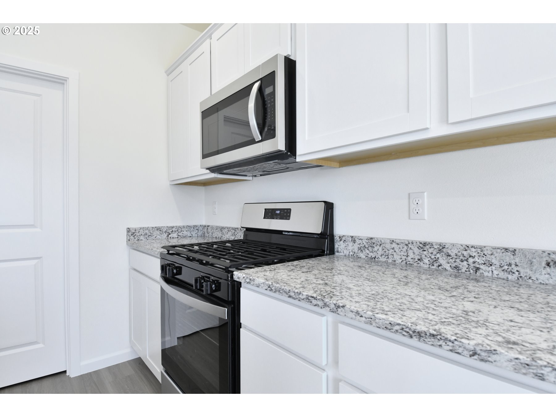 3990 Southwest Duniway Lane Gresham, OR 97080 - Photo 13 of 20 a kitchen with stainless steel appliances granite countertop a sink and a stove