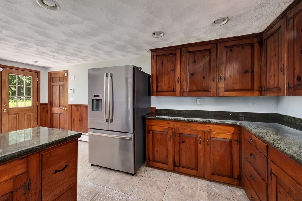 546 Ipswich Road Boxford, MA 01921 - Photo 3 of 27 a kitchen with stainless steel appliances granite countertop a refrigerator and a sink