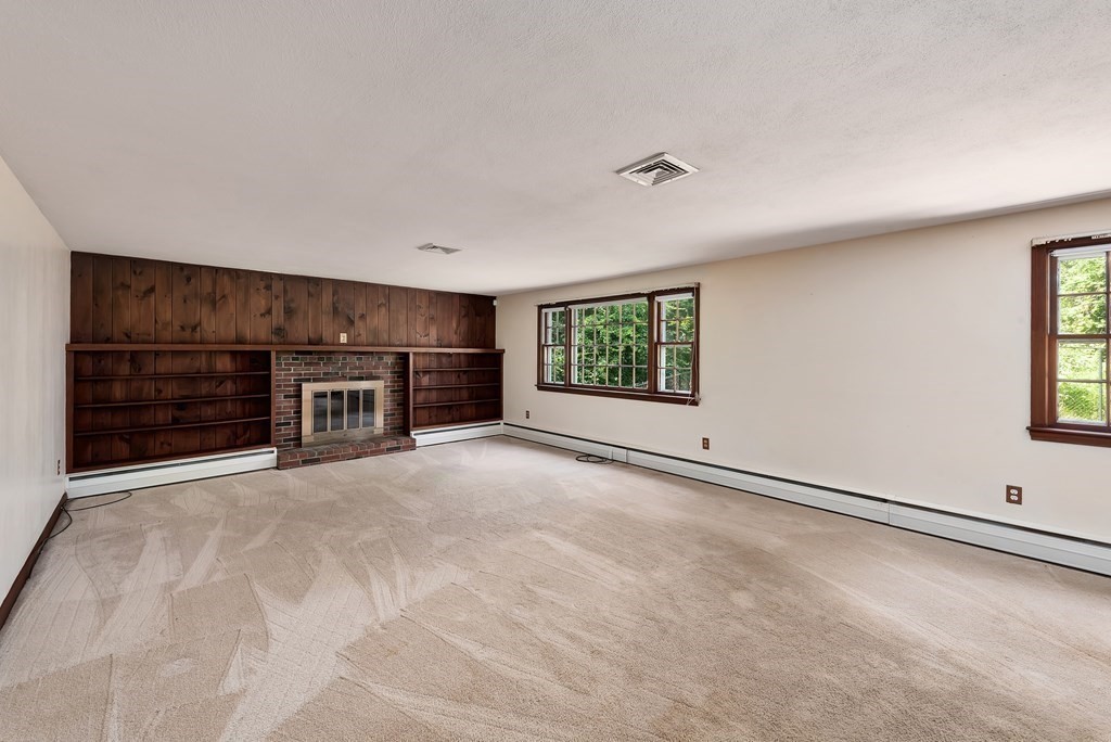 546 Ipswich Road Boxford, MA 01921 - Photo 6 of 27 an empty room with windows