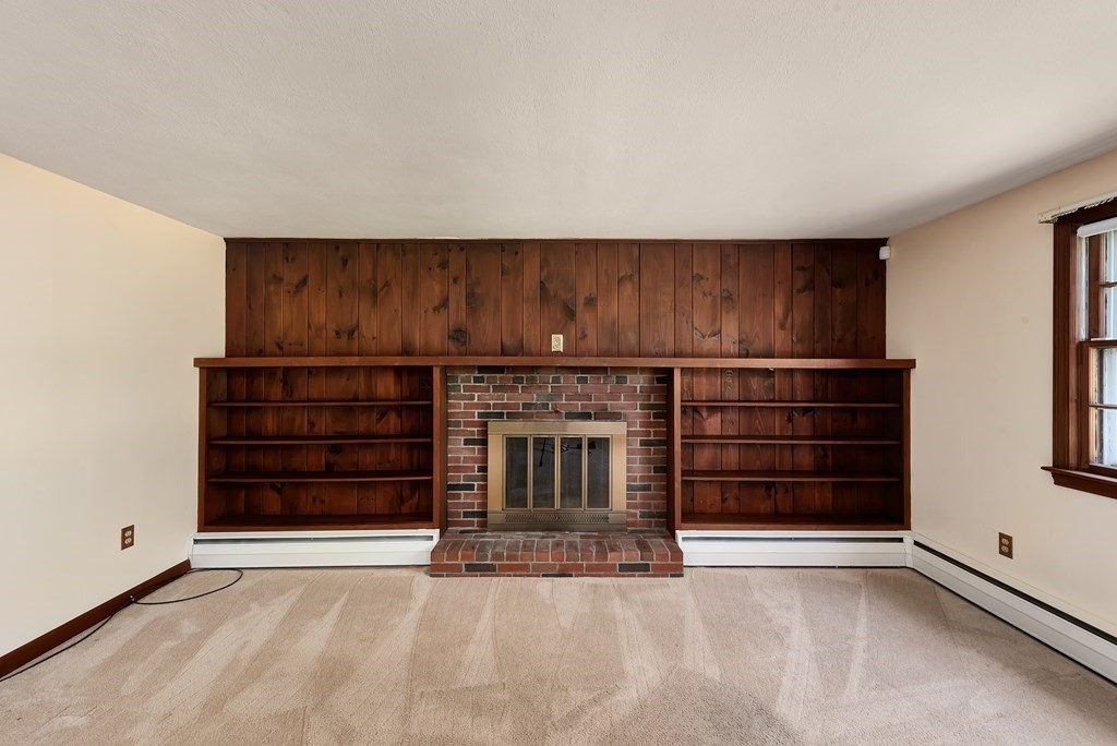 546 Ipswich Road Boxford, MA 01921 - Photo 7 of 27 a view of an empty room with furniture and window