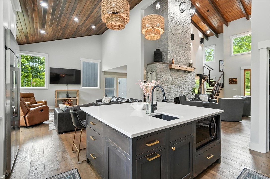 9258 Clyo Road Dayton, OH 45458 - Photo 15 of 68 6'x6' island with quartz countertops, pop up outlets, vegetable sink and more storage.