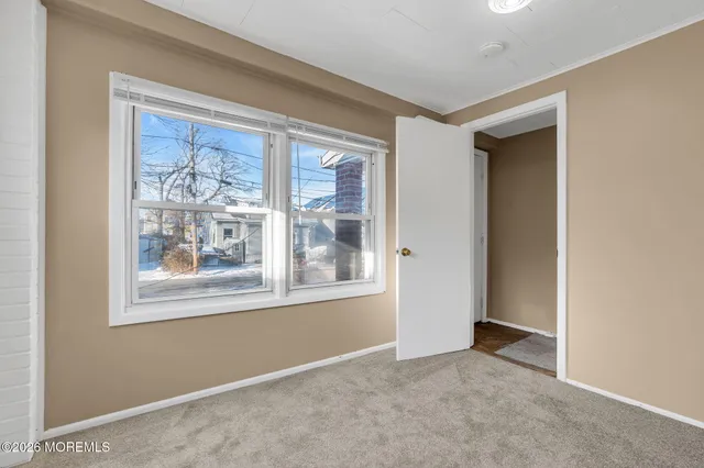 an empty room that has a window