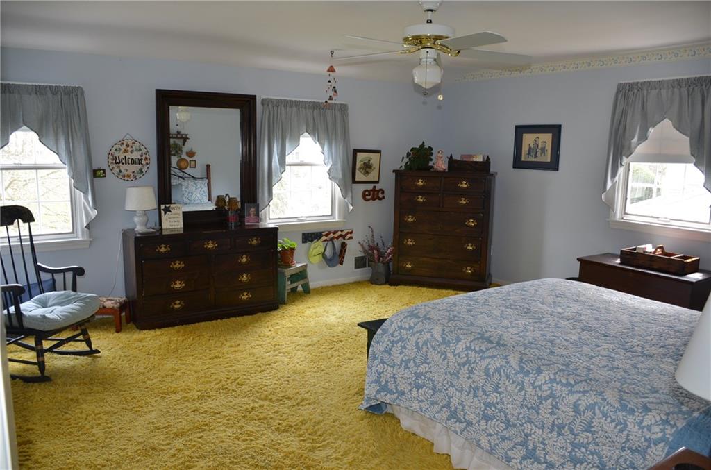 8187 Post Road Allison Park, PA 15101 - Photo 13 of 24 The Second Bedroom is almost as large as the Master, as a large 8' closet, ceiling fan and never exposed hardwood under the carpet in addition to lots of natural light.