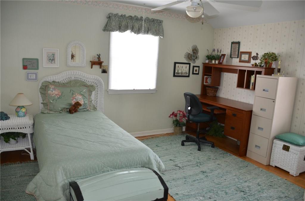 8187 Post Road Allison Park, PA 15101 - Photo 14 of 24 Bedroom three has exposed hardwood floors, large closet and a ceiling fan.