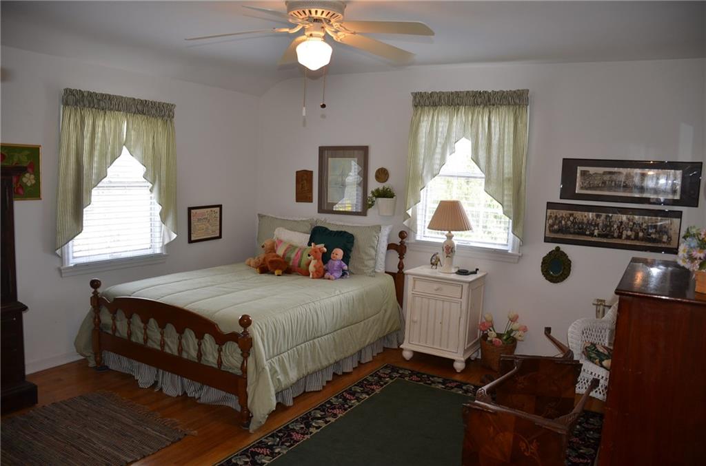 8187 Post Road Allison Park, PA 15101 - Photo 15 of 24 Bedroom number four has exposed hardwood floors, large closet, ceiling fan and lots of natural light.