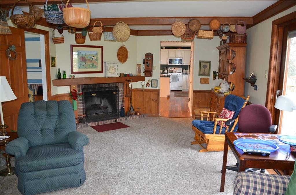 8187 Post Road Allison Park, PA 15101 - Photo 5 of 24 The first floor Family Room features a gas fireplace, solid wood beams and never exposed hardwood under the carpet.