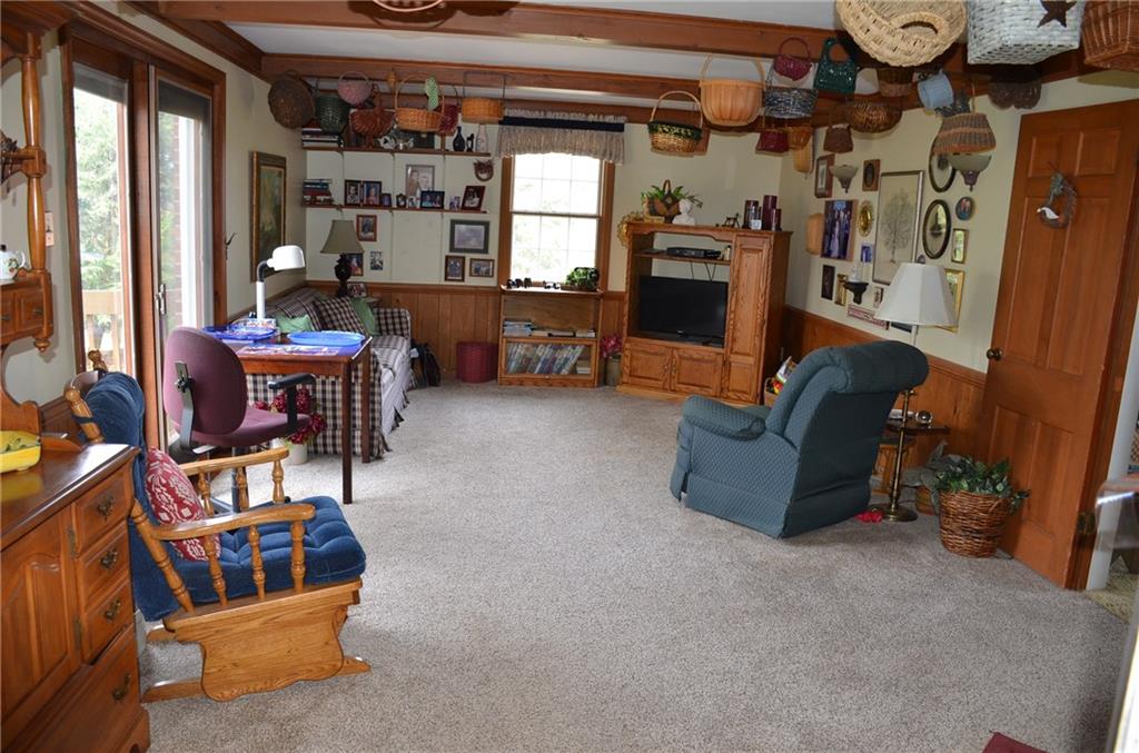 8187 Post Road Allison Park, PA 15101 - Photo 6 of 24 Other features of the Family Room are the wood wainscot with chair rail, solid pine door between the Living Room and Family Room for privacy and a sliding Pella patio door to access the deck.