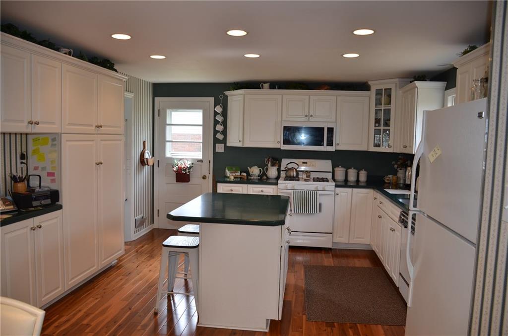 8187 Post Road Allison Park, PA 15101 - Photo 7 of 24 The updated kitchen features recessed lighting, all appliances, built-in pantry, center island and solid surface counters.