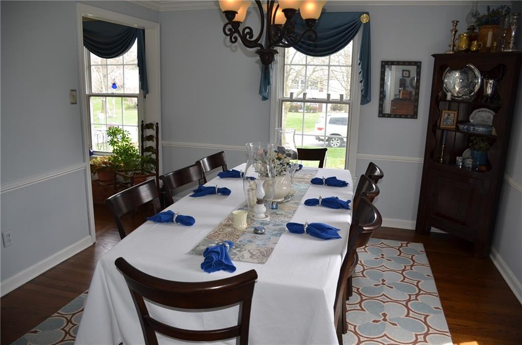 8187 Post Road Allison Park, PA 15101 - Photo 9 of 24 The Formal Ding Room is large enough for family gatherings with an updated chandelier, in addition to plenty of natural light.