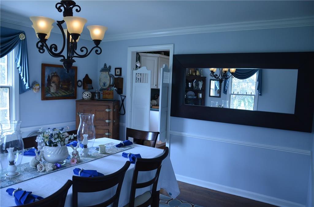 8187 Post Road Allison Park, PA 15101 - Photo 10 of 24 Other features of the Formal Dining Room are the hardwood floors, chair rail, crown mould and caf doors from the kitchen.
