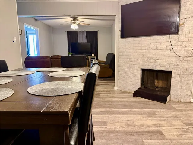 a dining room with furniture and a fireplace