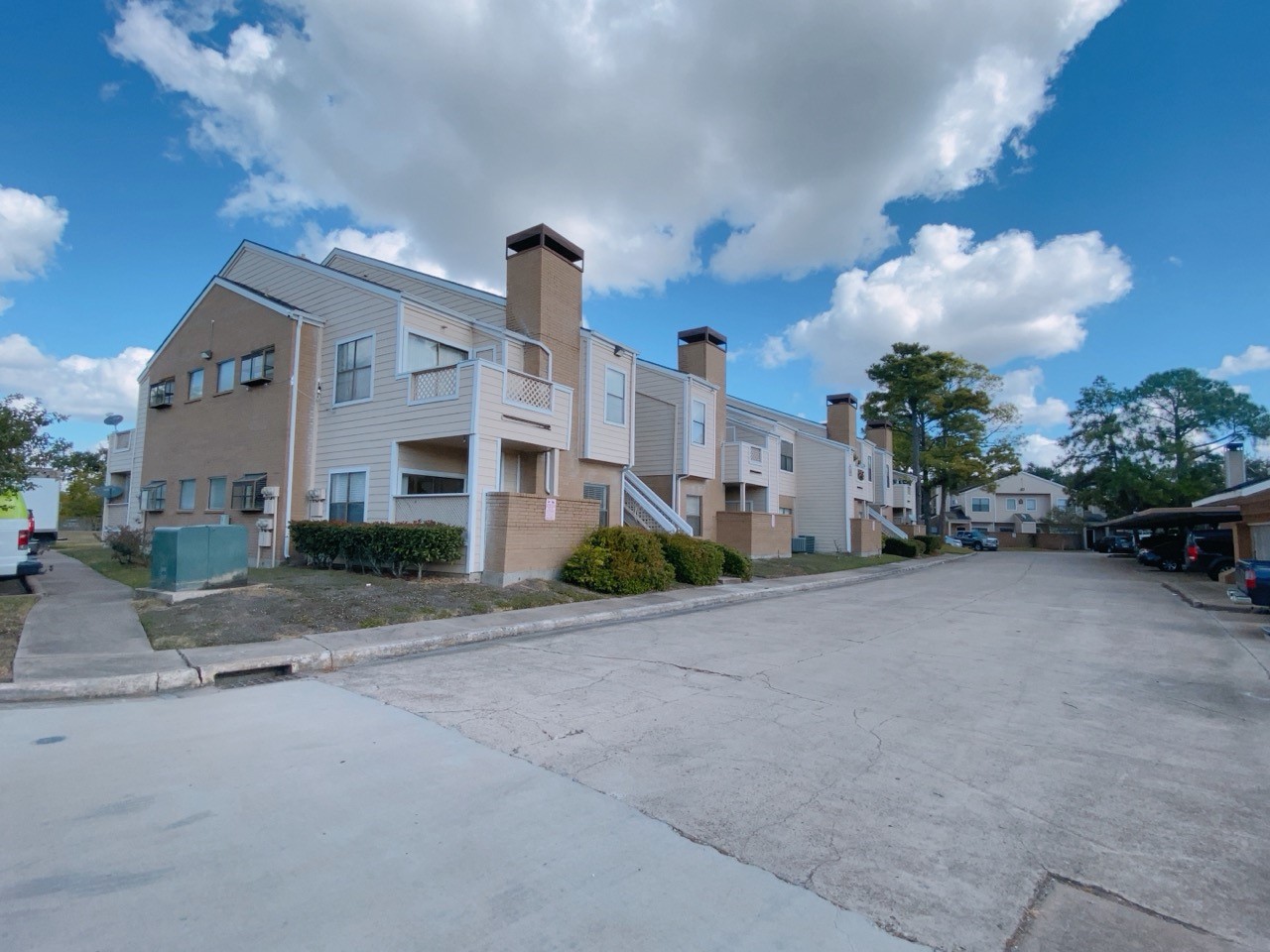 7900 Bissonnet Street, Unit C14 Houston, TX 77074 - Photo 13 of 14 a front view of a house with a yard and a street view