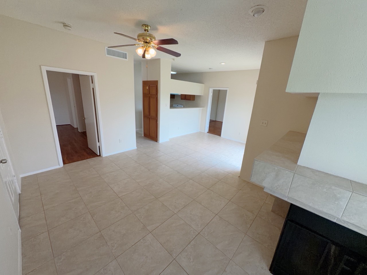 7900 Bissonnet Street, Unit C14 Houston, TX 77074 - Photo 3 of 14 a view of a kitchen with furniture and a ceiling fan