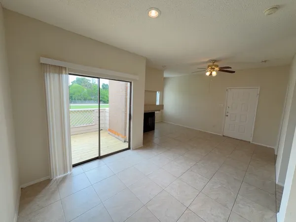 an empty room with a empty space and window