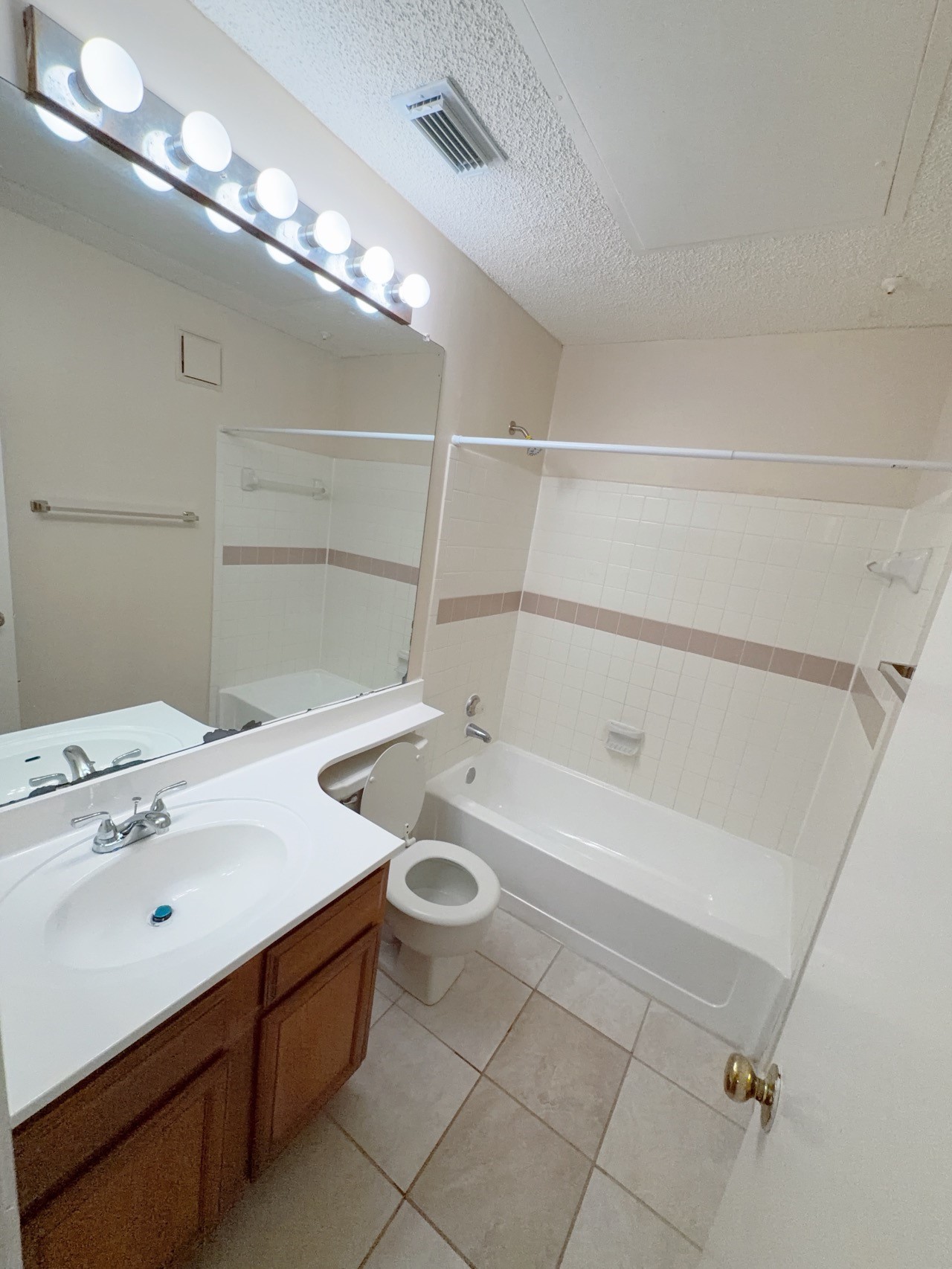 7900 Bissonnet Street, Unit C14 Houston, TX 77074 - Photo 8 of 14 a bathroom with a tub sink and mirror