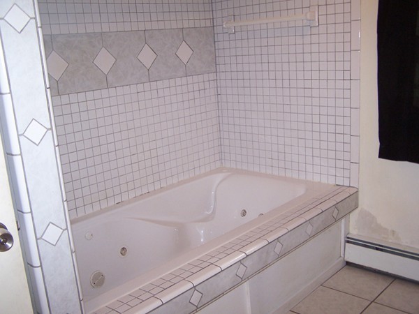 4 Apache Trail Rutland, MA 01543 - Photo 8 of 14 a bathroom with a bathtub and shower