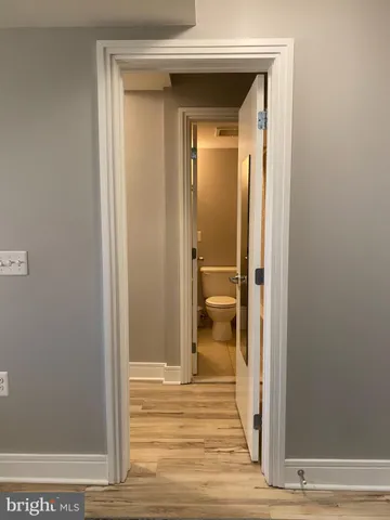 a view of a bathroom from a hallway