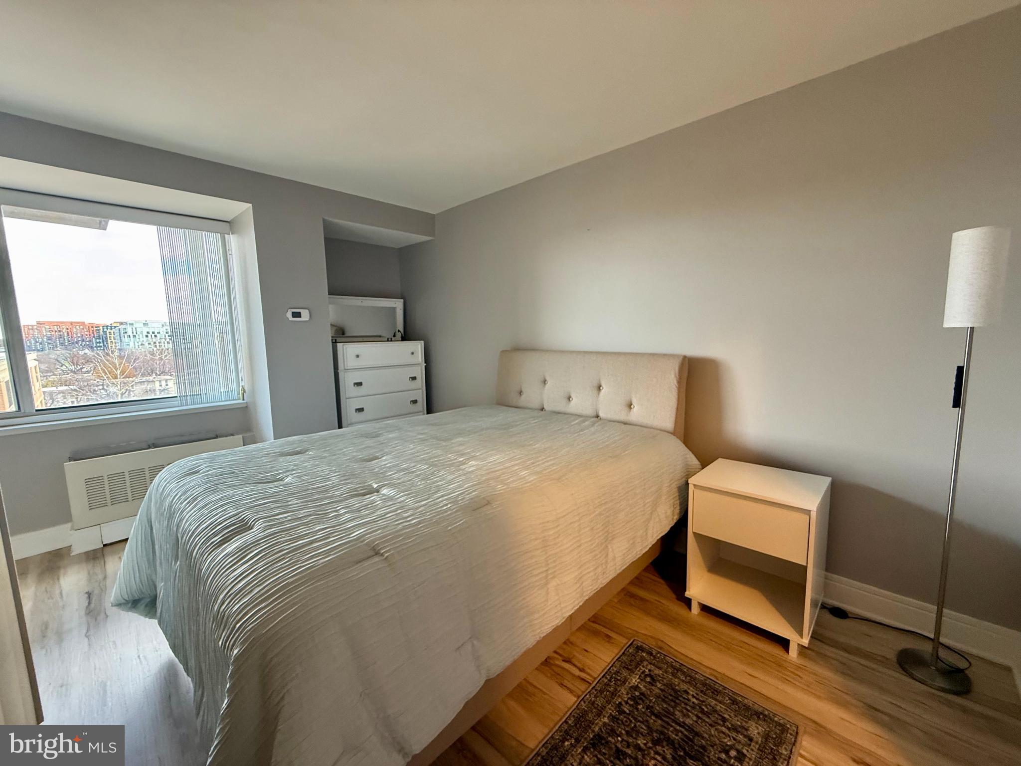 800 4th Street Southwest, Unit 610 Washington, DC 20024 - Photo 4 of 11 a bedroom with a bed and a window
