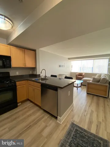 a kitchen with granite countertop lots of counter top space and a sink