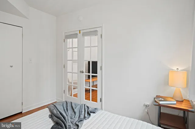 a bedroom with a bed and a window