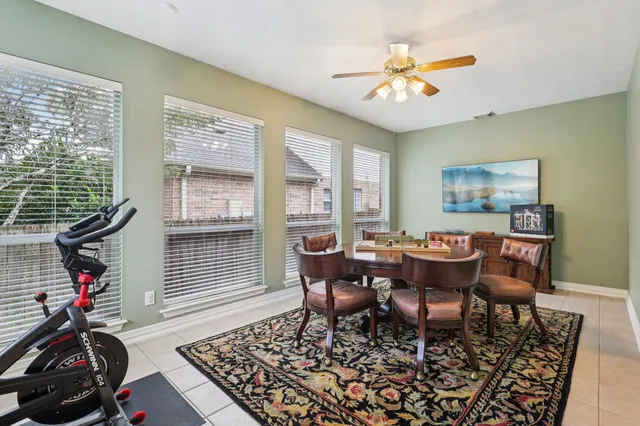 a view of a dining room with furniture wooden floor and a chandelier