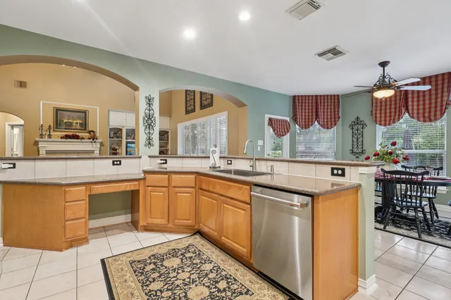 a kitchen with a sink and counter top space