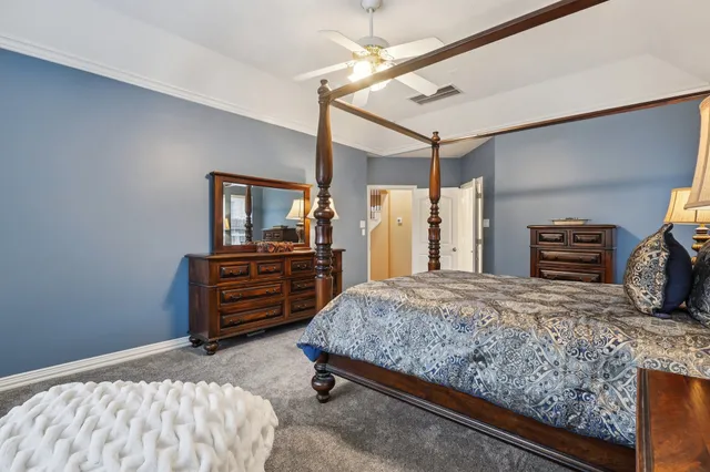 a bedroom with a bed and furniture