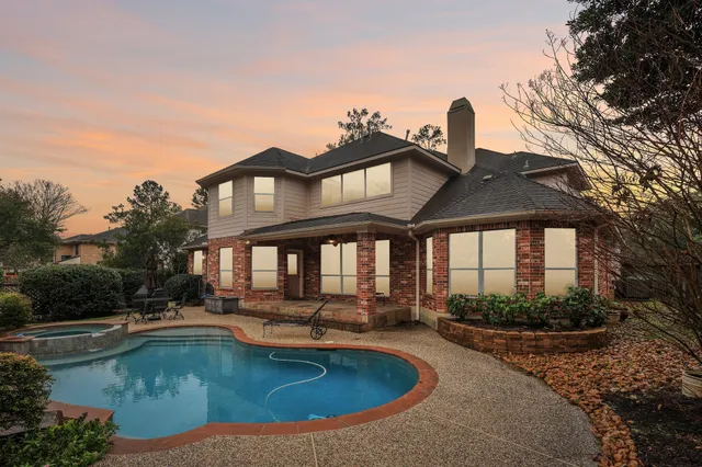 a front view of a house with swimming pool